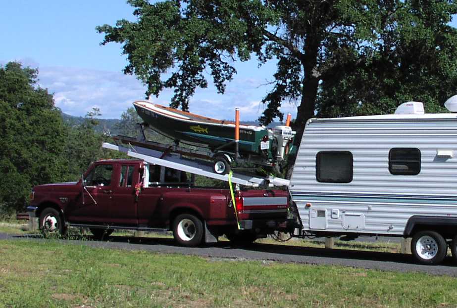 My Way
My GV11+xs on home built rack over pickup bed.  Allows taking boat and it's trailer along with a travel trailer for those extended fishing trips.  It has been in use for a few years now without any problems.  
