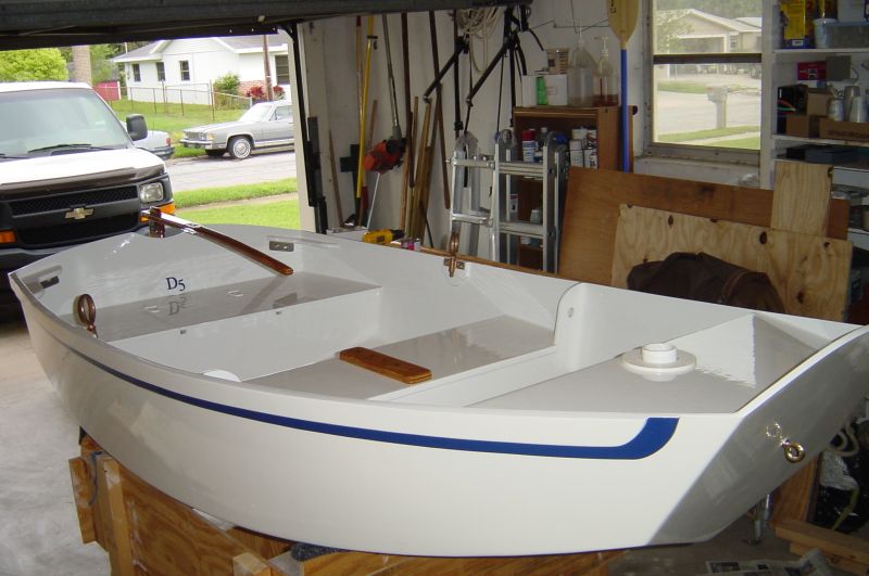 D5
The rub rail consists of 2 pieces of 1/4 ply flush with the transom and curved at the bow.  The rear seat is opened.  The D5 on the transom is painted wood.  The mast is stepped into a 2" pvc.
Keywords: D5