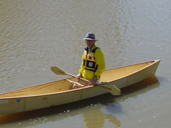 First Paddle
Made with "Multiply" by Weyerhauser. Multiply only comes in 4'x4' squares so there are a lot of scarfs in this hull. Sides are 1½" taller because I paddle kneeling. Gunnals and breasthooks are all hardwood as is the portage  yoke. Weighs 45 lb. Cartops and portages well. The portage yoke increases hull stiffness greatly. 

