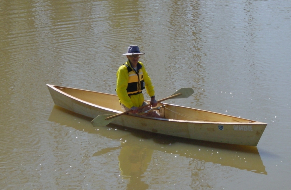 Trying the canoe out with a kayak paddle. It's about a foot-and-a-half too short for the 30" beam.
