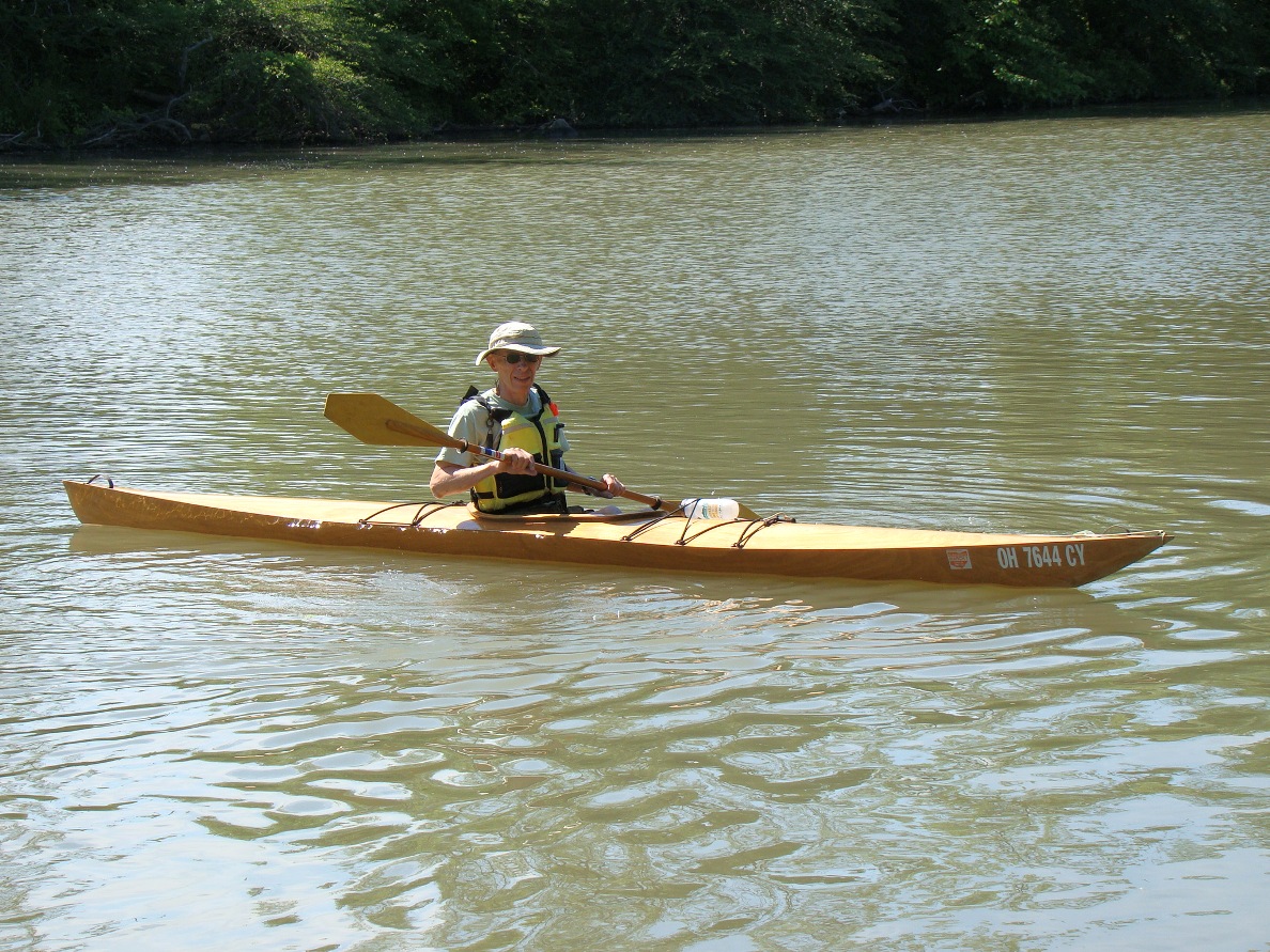 "Yare" by Chris Kulczicki. An ultralight kayak made from 3mm okoume using the "tortured plywood" technique. Yare is light (33 lb complete), very tight inside, tippier than most but, it slices thru' the water. Your legs may go numb and your back may hurt from the tight quarters but, you can't have everything.
I had to build a Cheap Canoe to get something more comfortable to paddle.
