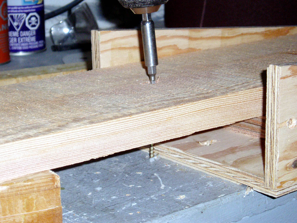 Scarfing Jig - Mount board
The board is laid on the workbench, through the jig's base .  I clamped with a screw along where I knew I'd be ripping the board.  To adjust depth beyond the router's range, just slide the jig alond the board.
