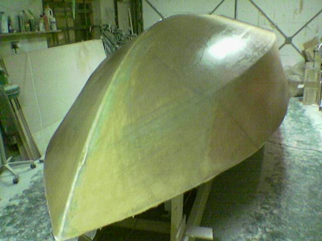 Post fairing Burnish
I Used a burnisher to burnish the Faired hull. This was hard work, but worth it, as I think I saved a lot of epoxy, and ended up with a REALLY smooth finish...
Once the epoxy has started to cure, RUB the coat really hard, with initially the burnisher set to a low angle, and as the epoxy gets harder, increase the angle.

