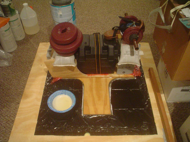 Tabernacle - The Big Press
Hey, didn't ks8 put too much pressure on that lamination?  Isn't he going to squeeze all the epoxy out of the joint?  Well, no.  :lol:  I put 6 oz cloth between the two panels.  That cloth is wet out, and each side of the wood was well wetted with epoxy also.  The cloth will not get squeezed out from between the two panels. The glass cloth is functioning as the *wood flour* glue.  We'll see how this works out and how long it lasts.   :)
