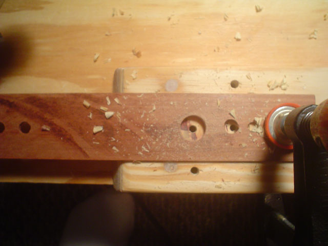 CB Slot Cap - forstner bit template guide
The fix of bit drifting over a predrilled screw hole, of course, was how to do it from the very start... with a template of a good hardwood.  This is about 1/8 inch mahogany.  
