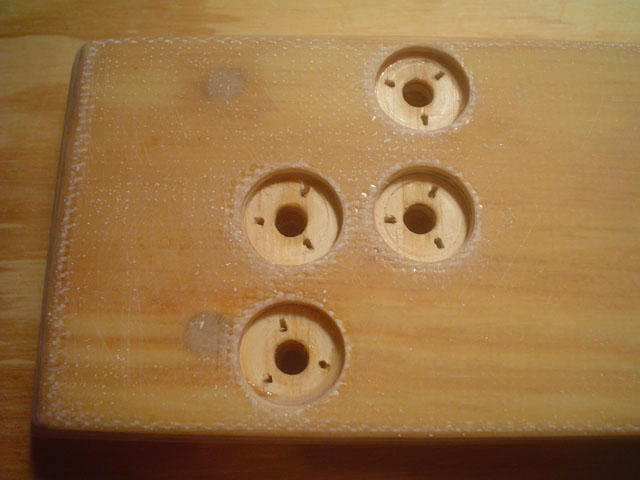 CB Slot Cap - cma cleat tnut recesses fully prepped and ready
And here, the CB case bottom has a layer of 6 oz on it (could have been 4oz but I ran out).  If moisture is long in the gap between case and cap, the wood is that much further away from moisture with a layer of glass sealing it. :)   The holes are already sealed with epoxy, and the recesses are now prepped and ready to have the t-nuts cranked down into some fresh epoxy.
