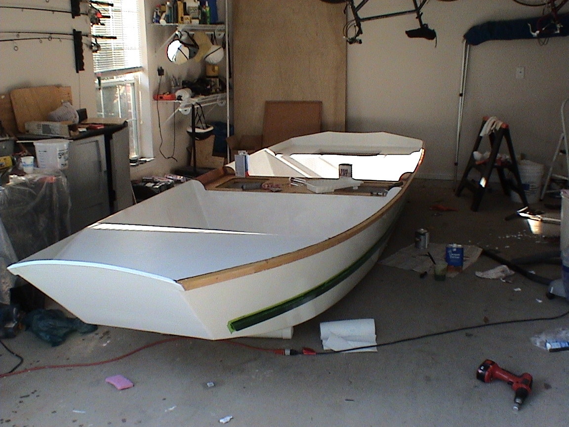 The outer hull is painted. Here, I've primed most of the inside, and am painting the rub and spray rails hunter green. I anticipate the launch within the next week or two. It's been a long, but enjoyable road.

