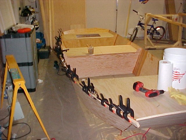 Startboard rubrail
Think I have enough clamps? The rub rails are plain Home Depot pine. They were flexible but somewhat hard.
