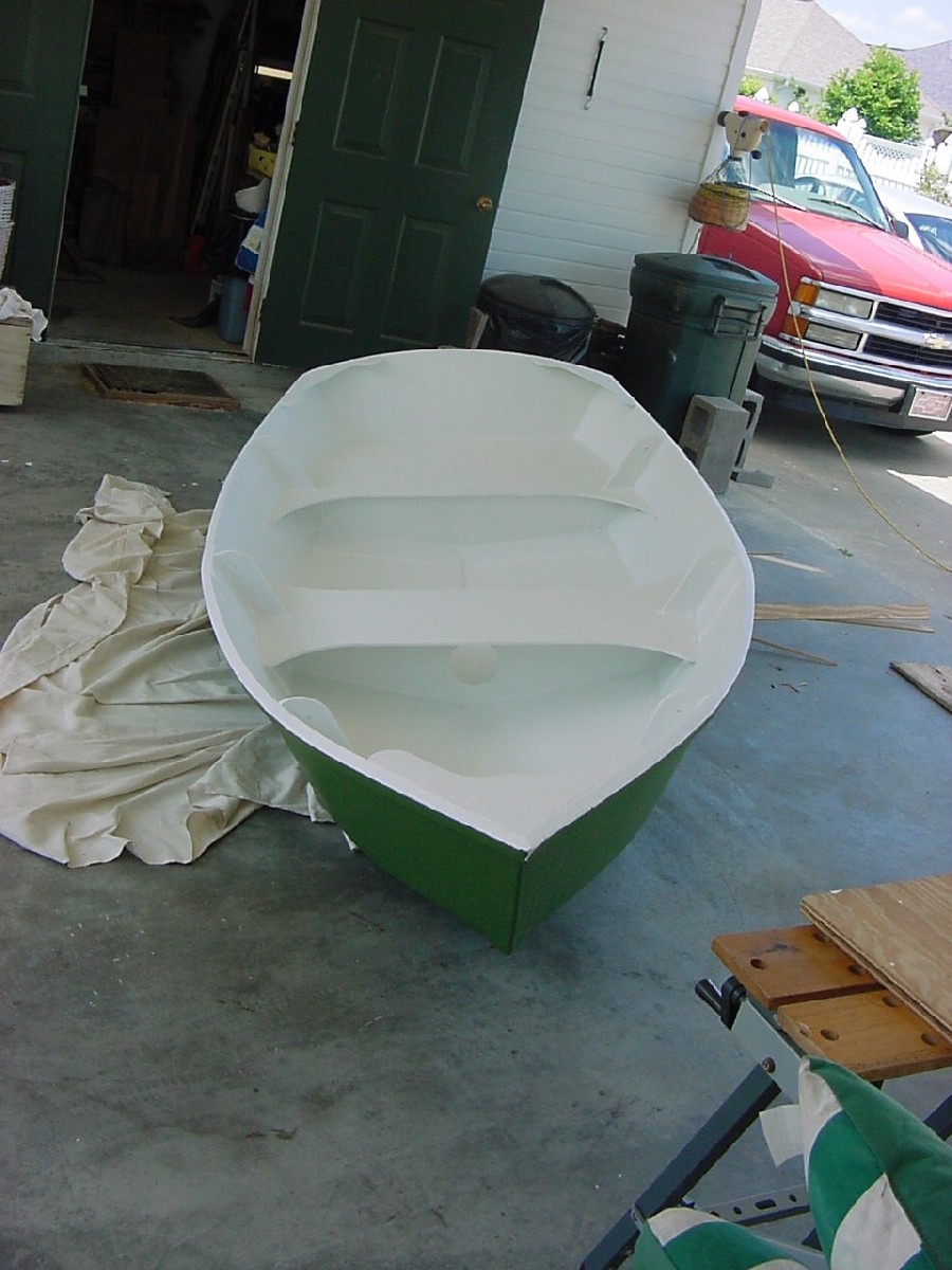Finish out primer in.
I decided on green as the finish color.  It's traditional for workboats down here.  Here you see the exterior with it's final coat on and the interior ready for the finish.
