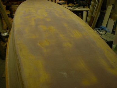 Bottom sanded
If only the fairing mix was the colour of Fir, I would not have felt my initial surface preparation should have received more attention. All the purple patches show the holes and valleys which needed filling ?????
