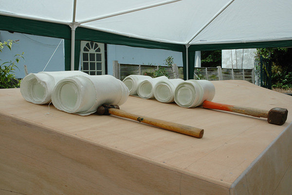 C17: Bi-axial tape.
Bi-axial tape cut to the right length and rolled up, in preparation for putting on the boat.

