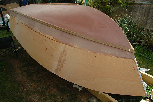 C17: The hull.
Well, this is the final hull. Still lots to do, like sanding, tape on the bow and transom corners, more sanding, sealing, painting etc.

And some sanding.
