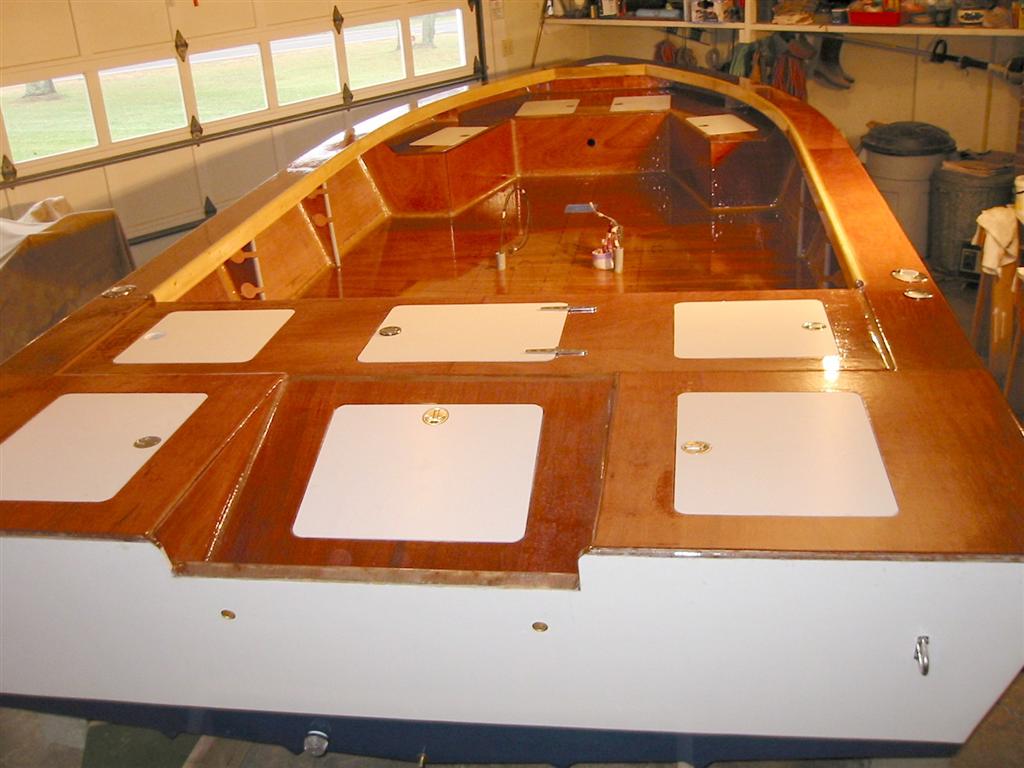 Phantom 22
All interior surfaces of the boat have now been covered in fiberglass with two additional applications of epoxy resin.  With the application of epoxy fairing where needed, the boat will be ready for the interior painting process.
