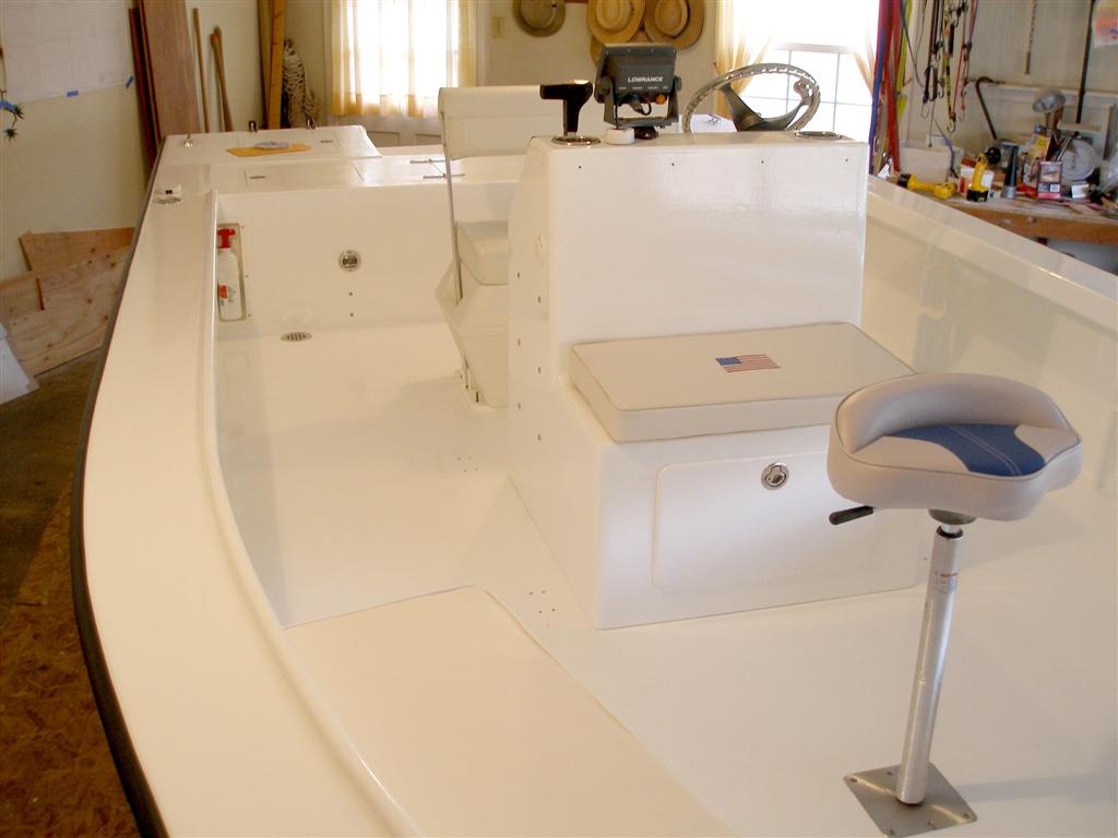 Phantom 22
Seats and console have been installed.  It is beginning to look more like the final product.  T-Top, windshield and stainless steel hand rails are yet to be installed.  The T-Top and windshield are too tall to be installed in the garage.  The boat must be outside on the trailer 
before this can happen.
