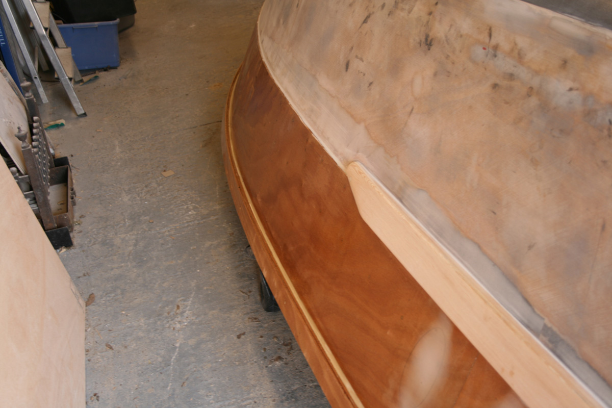 view from the stern showing sanded fillets on hull panel join & underneath rubrail
