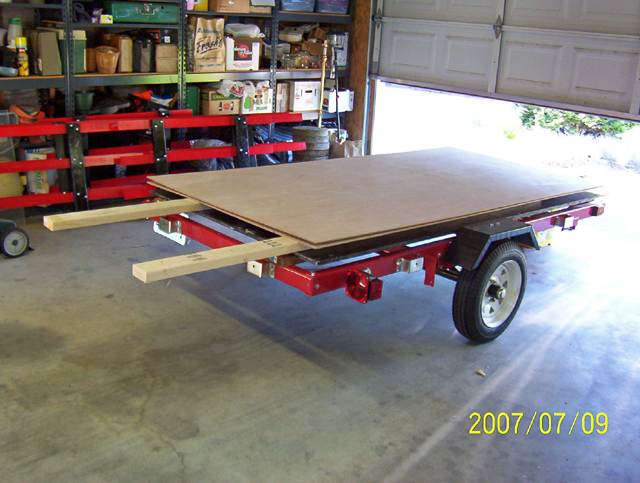 trailer put together to haul plywood, use as workbench and when finished will make a boat trailer out of it.
