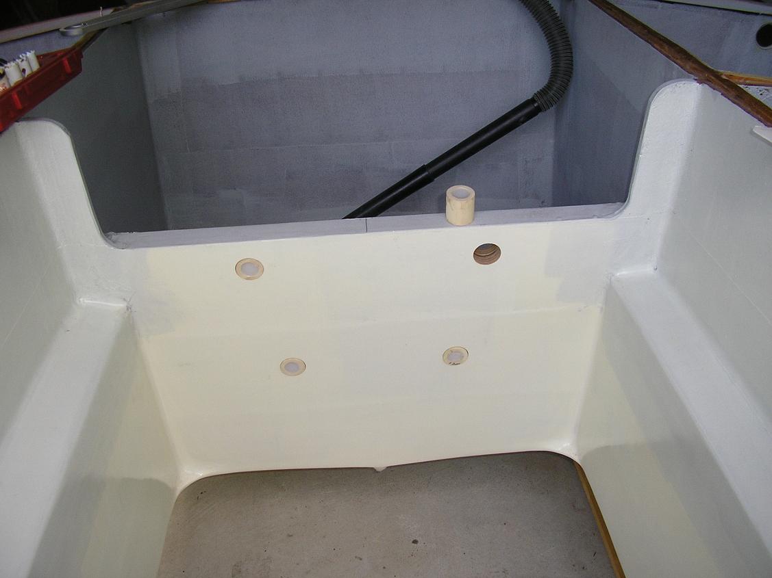 Motor mount holes in transom and epoxy-filled inserts.
