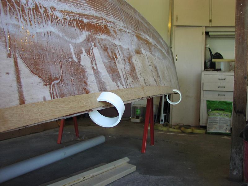 Rub-rail vs sheer line
Exterior hull is glassed and sanded but not faired.  The rub-rail will be laminated from strips of 1/4" ply, but the straight strips of ply don't follow the compound curve of the sheer line.   Pausing here for advise.
