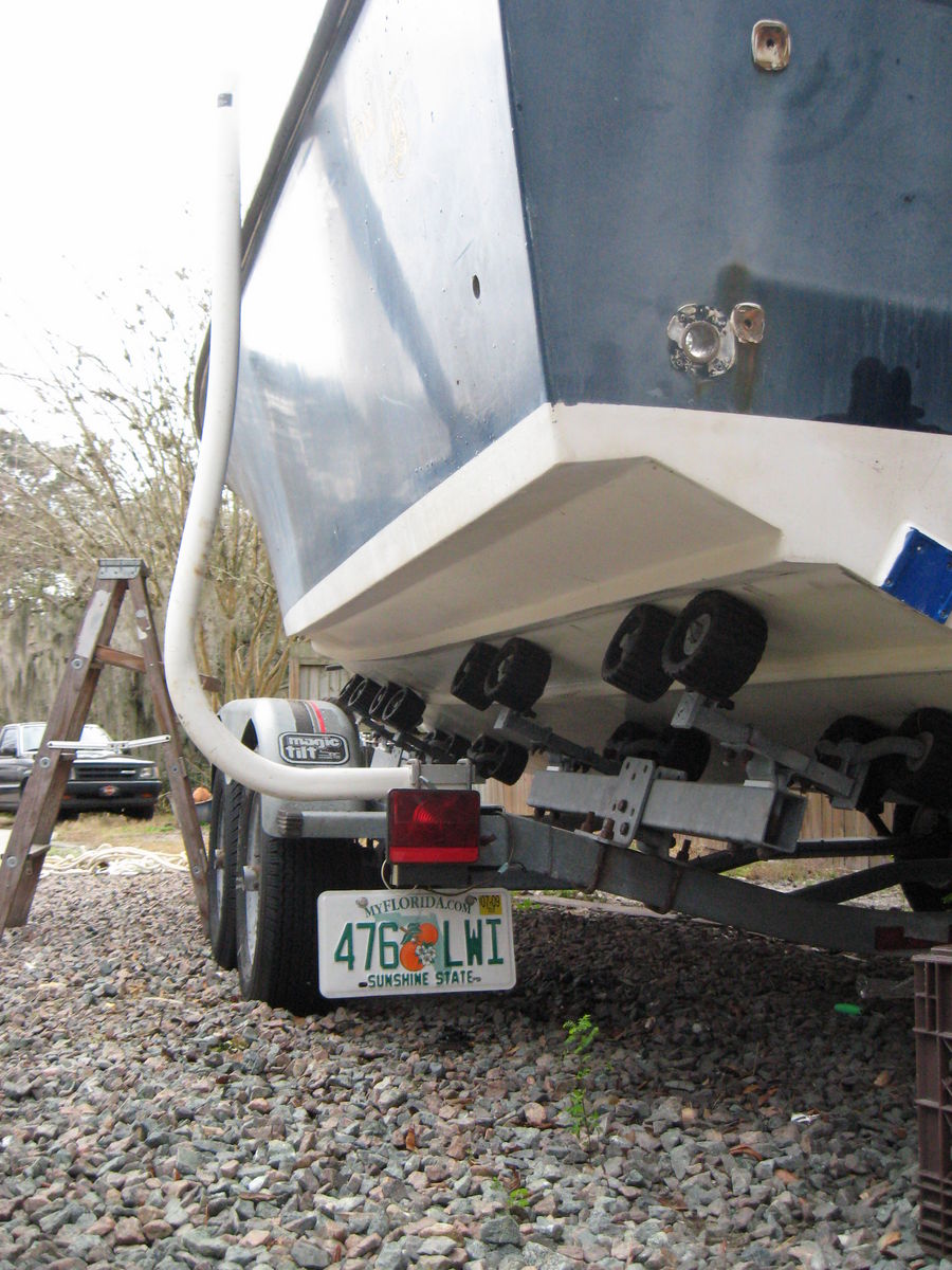 trailer rollers
shot of trailer that boat currently sits on. Not sure of this is sufficeint for keeping the boat aligned while gutting proceeds
Keywords: Fisf box floor stringer transom Fitz Center console
