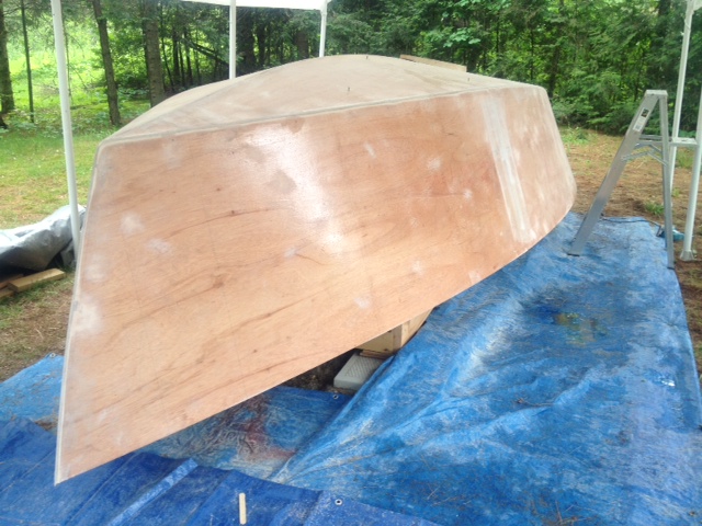 Harmony is started
All panels are pre-epoxied inside and out. I am building her under shelter, outside - full shelter enclosure will be set-up later during painting. The hull is sanded, seams radiused and just about to apply the bi-ax tape.
Keywords: HMD19